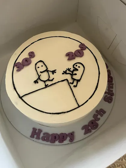 Another look at our popular "20s vs 30s" doodle cake, a fun way to mark a birthday with a relatable joke. The flavor inside is our Chocolate & Salted Caramel with Praline crunch.