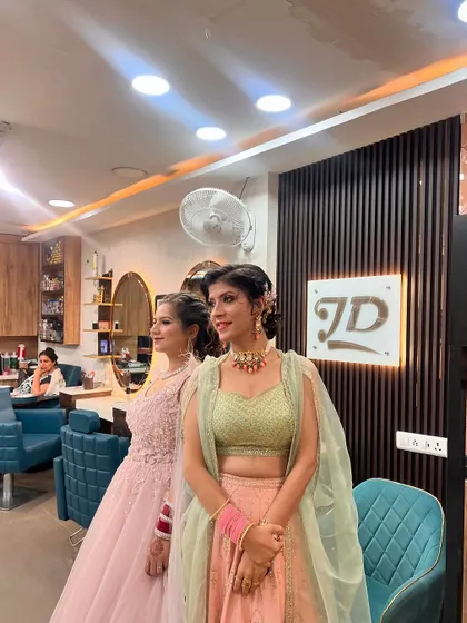 Another shot of our clients posing in the salon, showing off their different but equally glamorous looks.