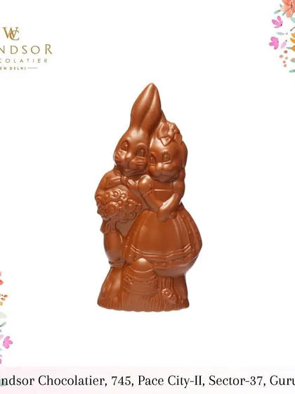 A lovely pair of chocolate bunnies in an embrace, a wonderful and sweet sculpture for celebrating love or friendship.