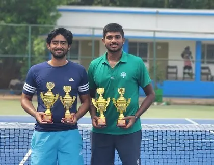 A mirrored shot showing the success of our players at the Bhubaneswar tournament, holding multiple trophies.