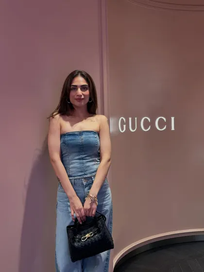 A close-up of the denim look, showing my Bottega Veneta bag which adds a touch of luxury.