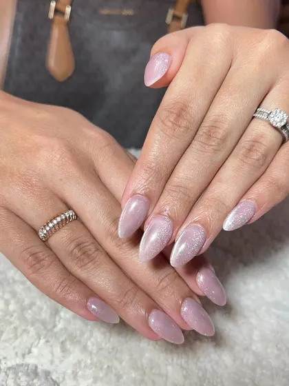 A beautiful set of shimmery lavender nails. The subtle glitter gives this classic color a magical touch.