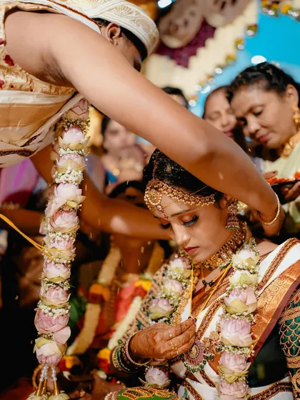 The sacred moment of the Mangalya Dharanam, where the groom ties the necklace, signifying their eternal bond.
