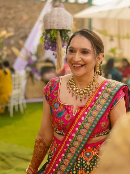 A candid shot of her laughing. The makeup is designed to look beautiful in every moment.