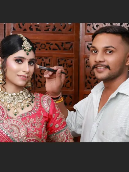 Another amazing creation by my student, Chetan. He is seen here giving the final touches to a beautiful bridal look.