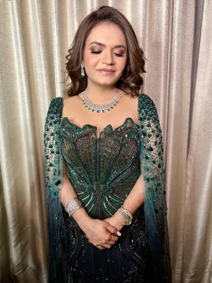 A serene shot with eyes closed, highlighting the neutral, shimmery eyeshadow.