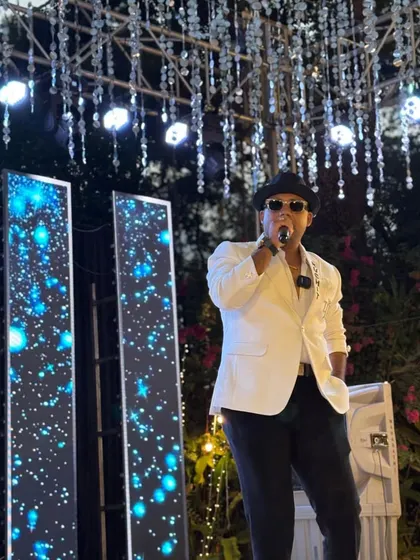 A classy white blazer for a glamorous evening event. Paired with a hat and sunglasses, this look is perfect for a sophisticated Sangeet or reception.