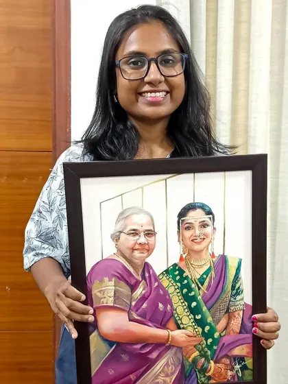 Here I am with the finished memorial portrait. It's a privilege to create art that holds so much meaning for a family.