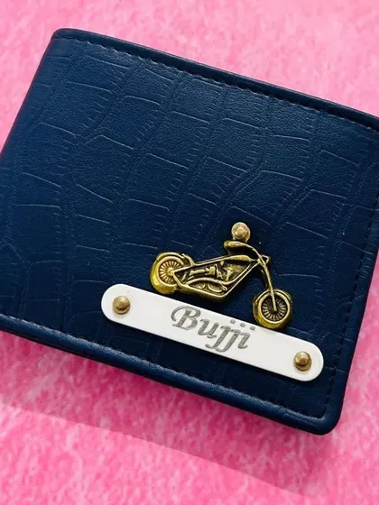 A close-up of the navy blue croc-textured wallet, personalized with a name and a motorcycle charm. Perfect for the bike lover in your life.