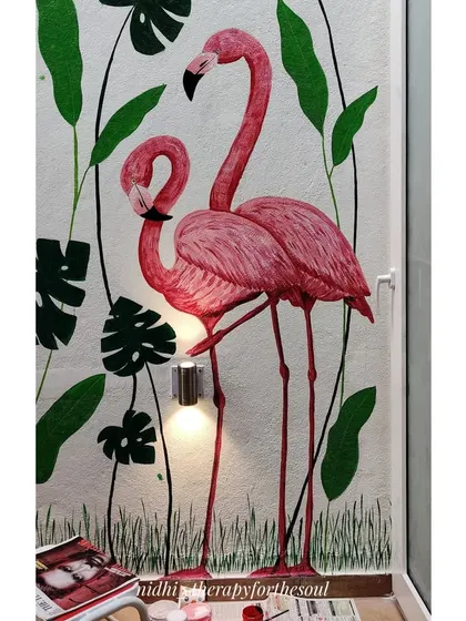 This detail shot captures the pair of flamingos. The way they interact adds a narrative element to the vibrant, nature-filled scene.