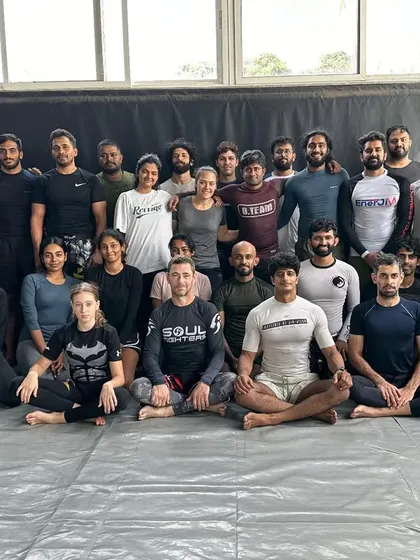 A group photo with my BJJ team. I maintain a white belt mentality, always open to learning and growing.