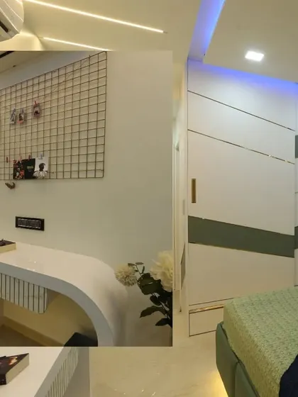 This bedroom includes a sleek, modern study desk with a grid board for notes and photos, seamlessly integrated into the room's design.