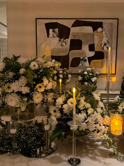 Another view of the candlelit floral tablescape, showcasing how the decor transforms the entire dining room into a magical space.