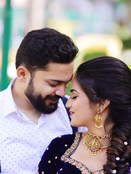 A beautiful moment between the happy couple. Our client looks lovely in a classic temple choker set that perfectly complements her navy blue and gold lehenga. We believe our jewellery is part of your story, and we are so happy to be a part of moments like these.