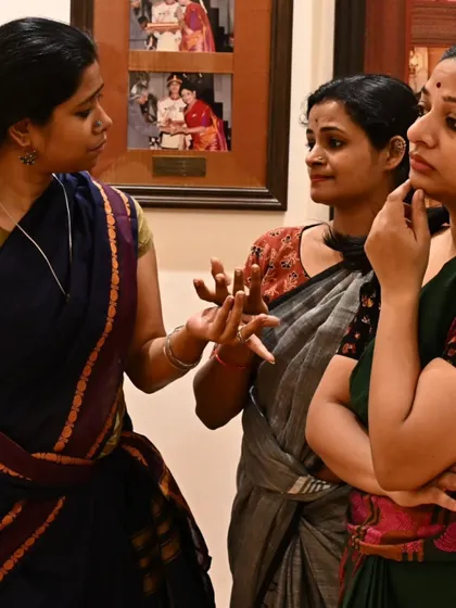 A moment of intense discussion and collaboration between dancers during a rehearsal. Crafting a new piece involves a lot of creative dialogue and shared understanding.