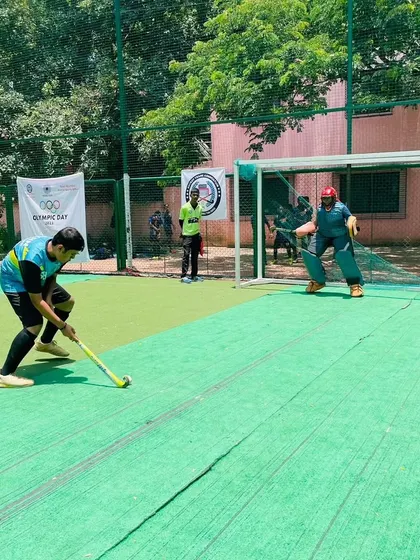 An adult player takes his turn in the Olympic Day penalty shootout. Our events are designed for all ages and skill levels to participate and have fun.