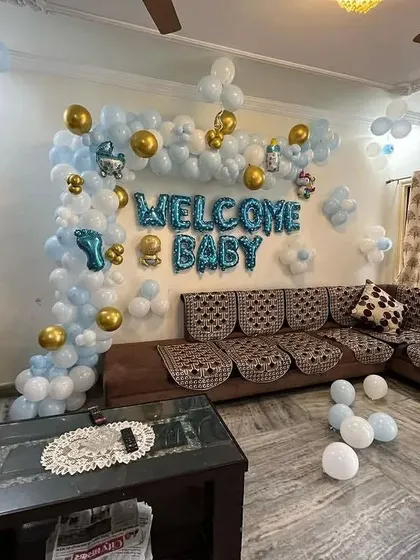 Another perspective of the living room setup, showing the full extent of the balloon decorations.