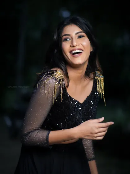 A candid, laughing moment from the same shoot. These genuine expressions are often the most compelling.
