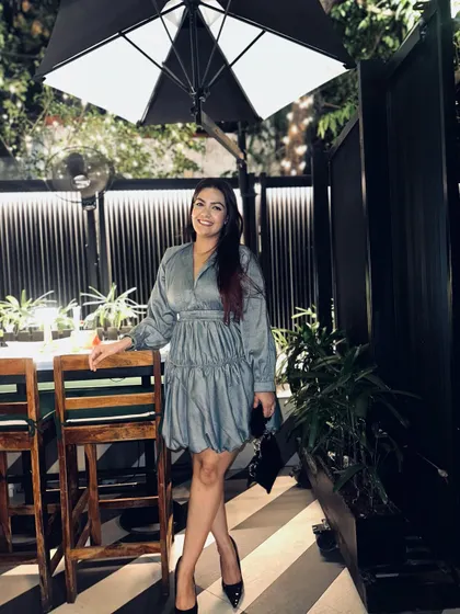 A happy, smiling pose in this fun and flirty blue dress.