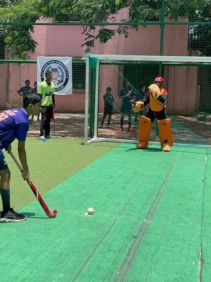 Another angle of the penalty shootout, showing the focus of the player and the readiness of the goalkeeper.