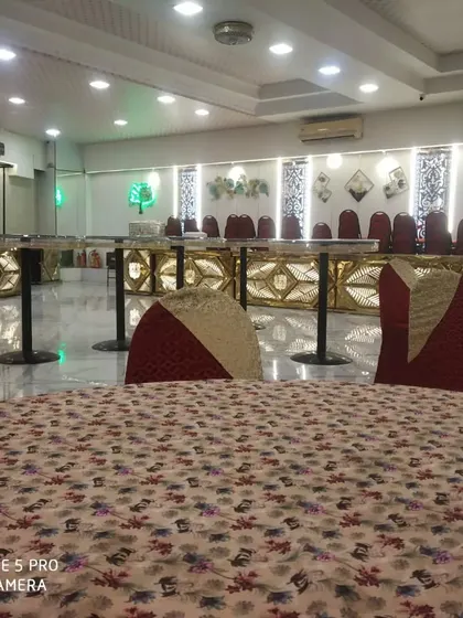 A full view of the empty banquet hall with my buffet stations in place, showcasing a clean and grand setup ready for the event to begin.