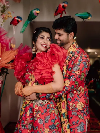 I love adding unique details, like these colourful parrots perched above the couple. It's these small, creative touches that make the decor personal and memorable.