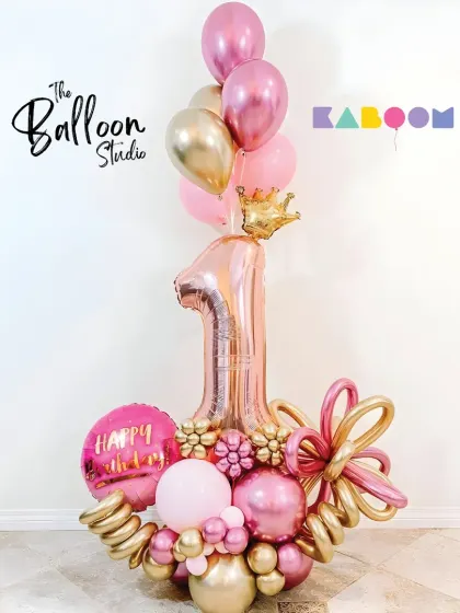 A royal first birthday! This pink and gold balloon bouquet, complete with a crown, is fit for a little princess.