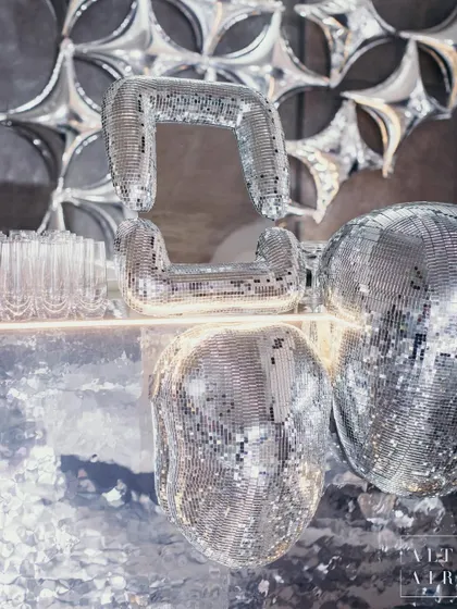 The coolest bar is here to steal your heart. At 'The Melting Disco Ball' after-party, we used mirrored blobs and amorphous shapes to create a dynamic interplay of reflections, transforming our understanding of space and time.
