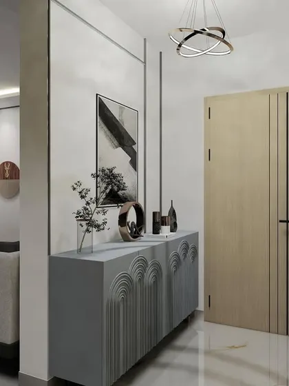 The entryway of the 'Earthy Minimalist' home, where a statement console and abstract art welcome you into the space.