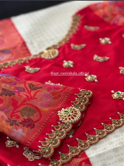 Another angle of the red blouse, showing the intricate detail of the kemp stone embroidery.