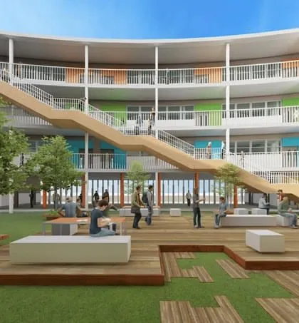 At JAV Junior College, a large central courtyard features an integrated staircase and multi-level seating areas. This space serves as the social heart of the college, promoting outdoor learning, collaboration, and well-being in a refreshing, open environment.
