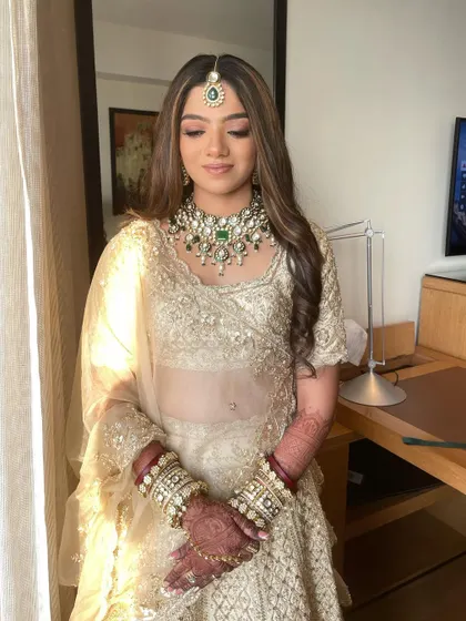 The sunlight beautifully highlights Mahek's dewy skin. This look is all about achieving that 'glass-skin' finish that looks healthy and radiant.