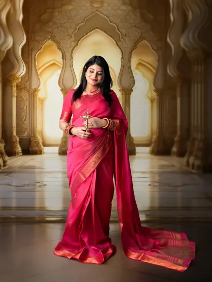 A fine art portrait with a majestic feel. We used a digitally composed background of a palace hall to give this pink saree portrait a grand and timeless quality.