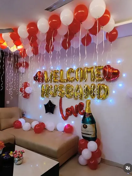 A 'Welcome Husband' decoration to give your partner a special surprise. The setup includes red and white balloons and foil letters.