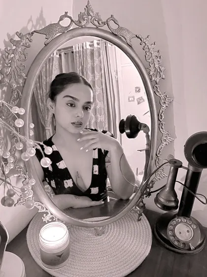 A self-portrait in an ornate mirror, reflecting on the month's gigs. My life is a mix of high-energy nights and quiet moments of solitude and reflection.