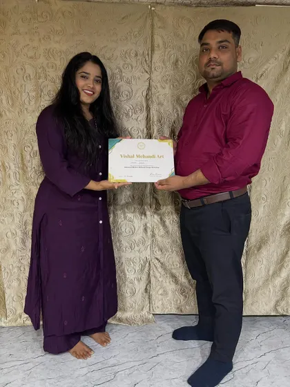 Celebrating another student's achievement. She completed the full course and is now a certified mehandi artist.
