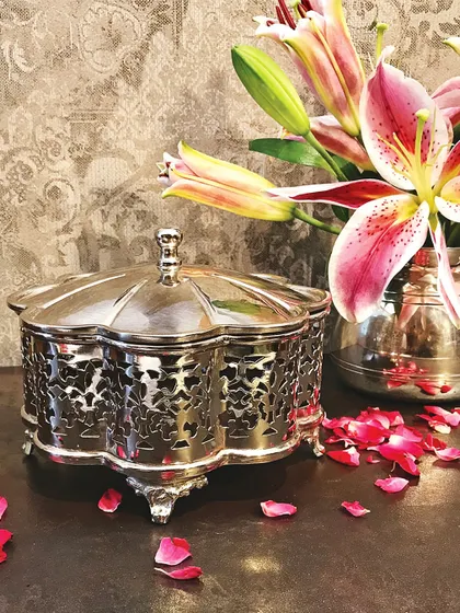 Weddings are a series of beautiful moments. This ornate silver filigree box is a gift made to match that spirit, functional for storing jewelry or sweets and designed to last.