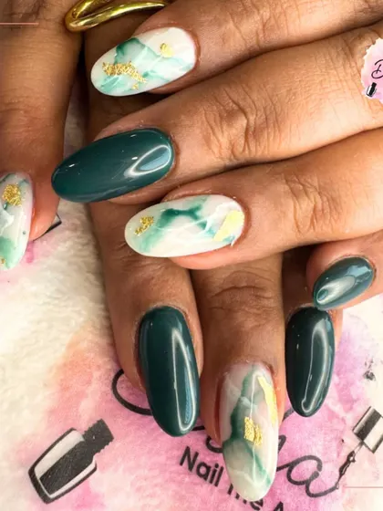 A fresh green base with a golden finish on top. This design features a mix of solid green and a green marble effect with gold foil.