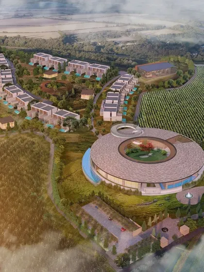 This conceptual masterplan for a project nestled within vineyards features a circular pavilion as its centerpiece. The design celebrates craftsmanship and the surrounding nature, creating a sensory journey that blends the essence of wine and architecture.