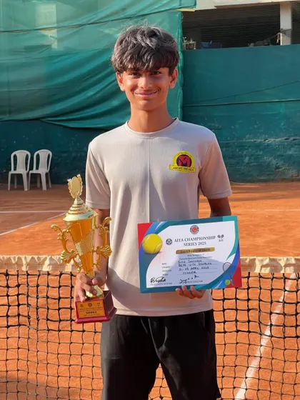 A great shot of Svar on the clay court with his CS7 U-14 Doubles winner's trophy and certificate.