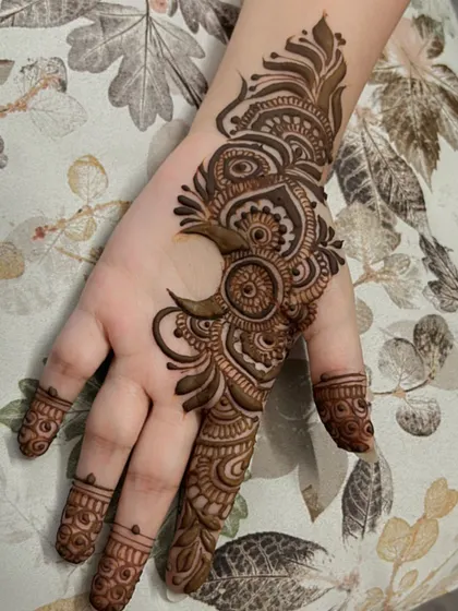A creative moon-inspired design for a client. This is a perfect example of a modern, artistic take on henna.