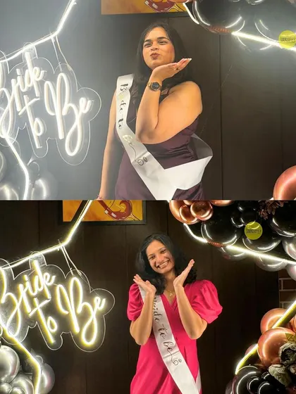 Two happy brides-to-be posing in front of the "Bride to Be" neon sign. Our decor is all about creating the perfect photo opportunities for the squad.
