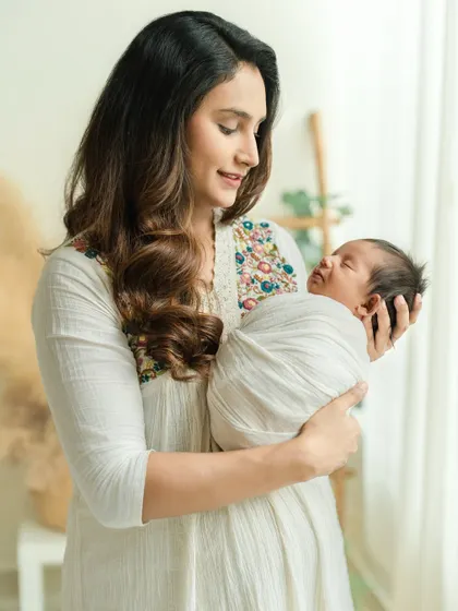 The serenity of a mother holding her newborn for the first time is a moment of pure grace. I aim to capture this profound bond in a soft, gentle, and timeless way during my newborn photography sessions.