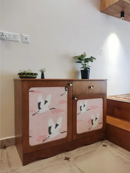 Another angle of the small cabinet, showing how it fits perfectly into the reading nook next to the platform bed.