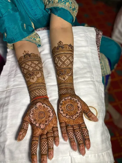 This full-hand design is a perfect example of traditional Rajasthani mehandi. The patterns are intricate and dense, creating a rich and beautiful look.