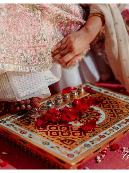 The 'Saptapadi' ritual, where the bride touches seven betel nuts, symbolizing the seven vows of marriage.
