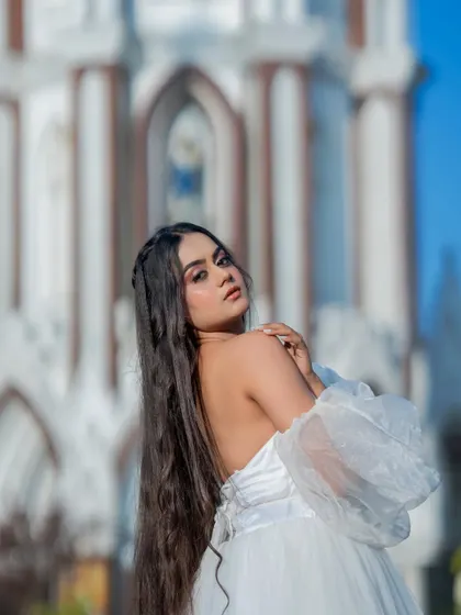 A dreamy, angelic look for a Christmas themed shoot. The makeup is soft and ethereal, with a focus on glowing skin and long, flowing hair.