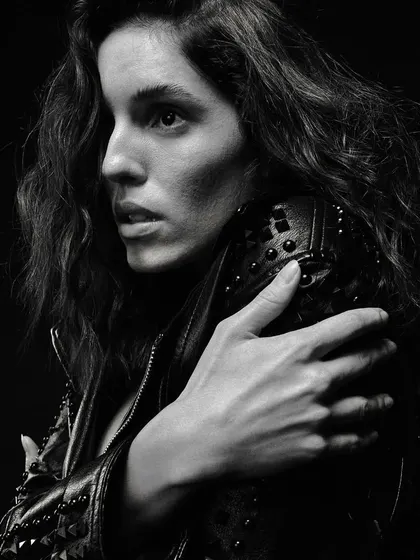 A classic black and white portrait with a leather jacket, creating a timeless, cool, and edgy look.
