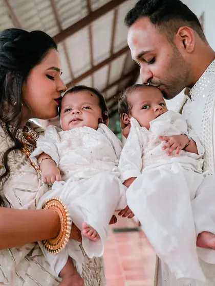 A heartwarming moment from a naming ceremony for twin baby boys. We specialize in capturing the joy of family traditions, documenting the love and blessings surrounding your little ones.