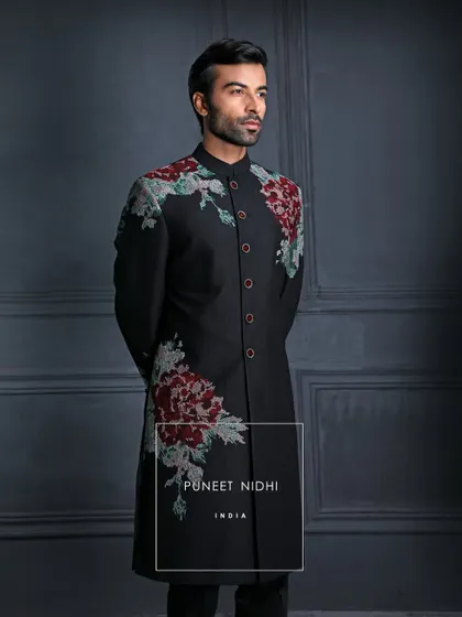 Wrap yourself in the grandeur of my classic black achkan, where every stitch and every vintage rose embroidery whispers luxury and poise.